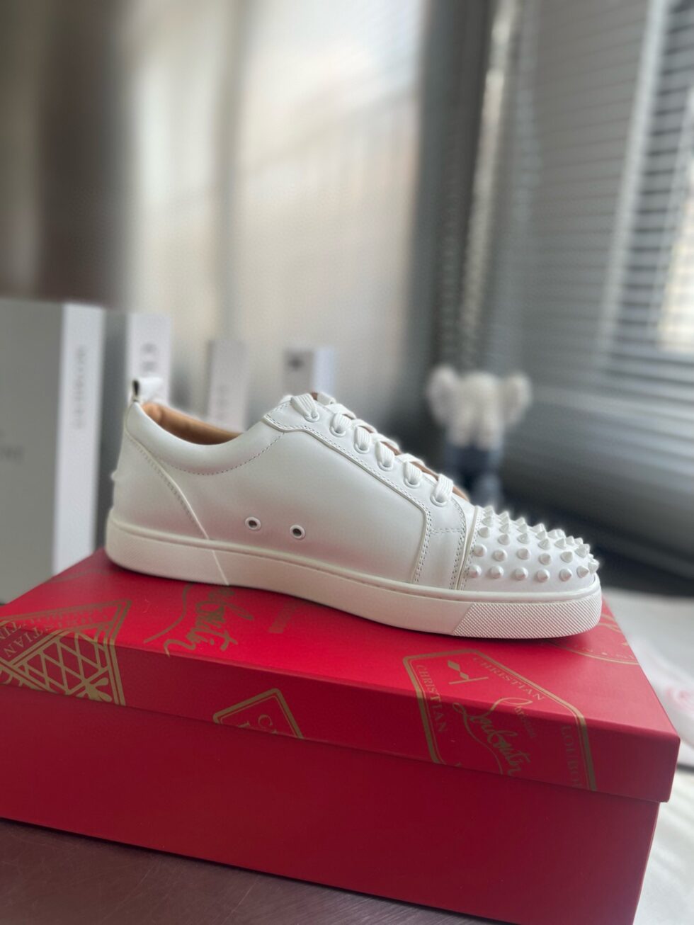 Replica Christian Louboutin Women’s Louis Junior Spikes Sneakers In White Leather 108