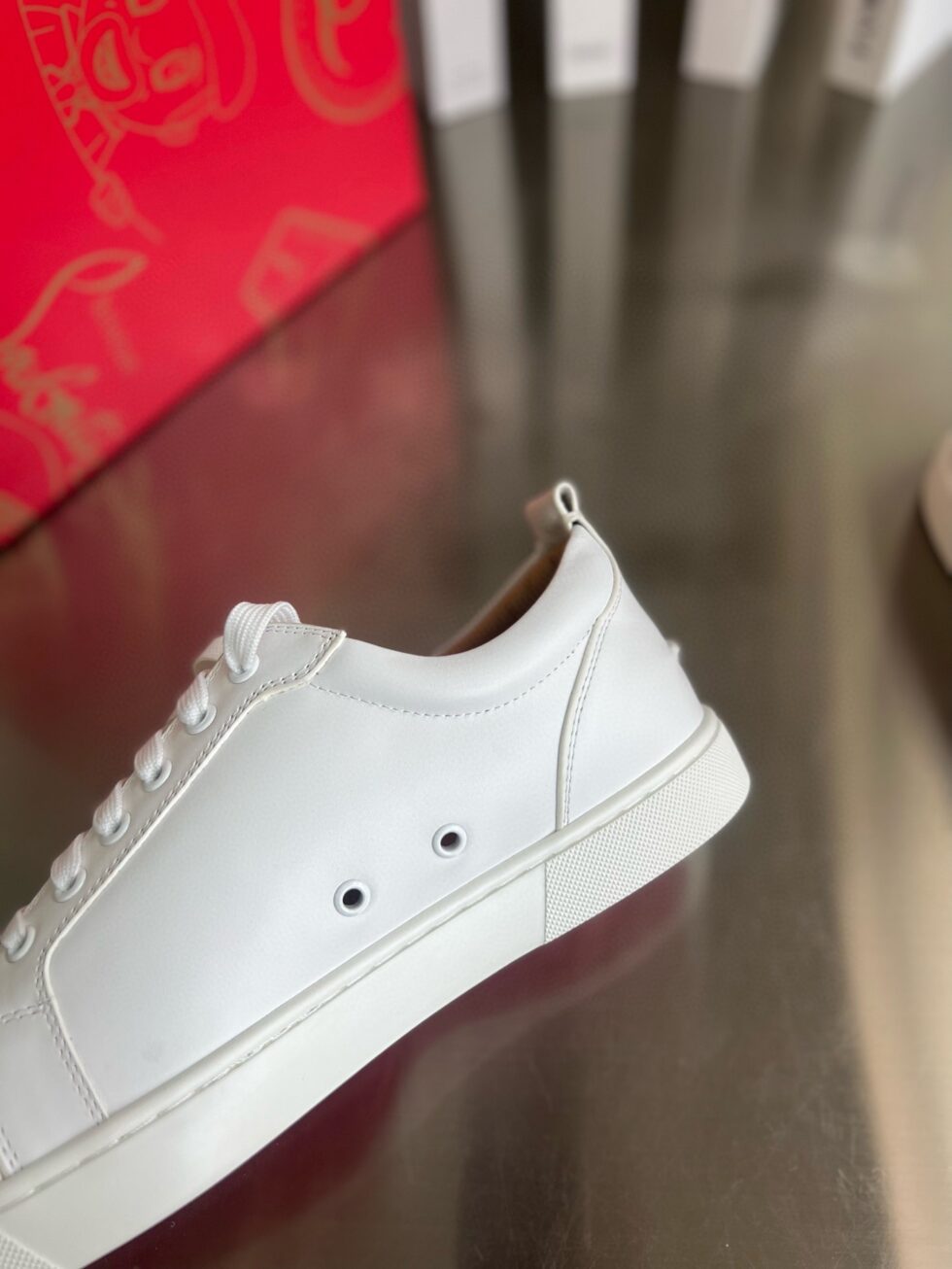 Replica Christian Louboutin Women’s Louis Junior Spikes Sneakers In White Leather 110