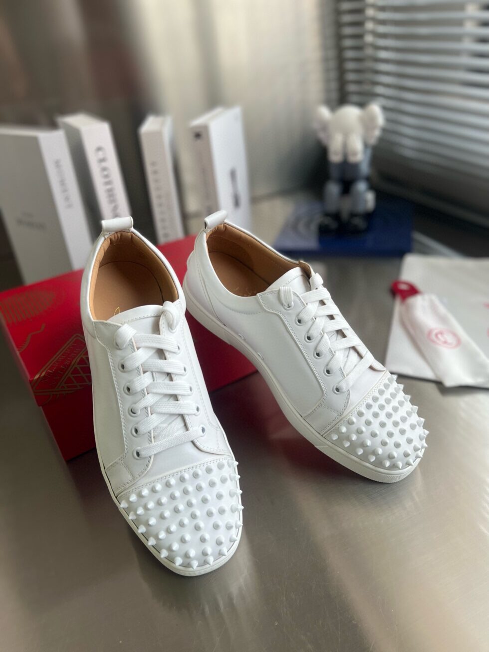 Replica Christian Louboutin Women’s Louis Junior Spikes Sneakers In White Leather 112