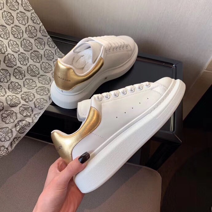 Replica Alexander McQueen Women’s Oversized Sneakers With Gold Heel 105