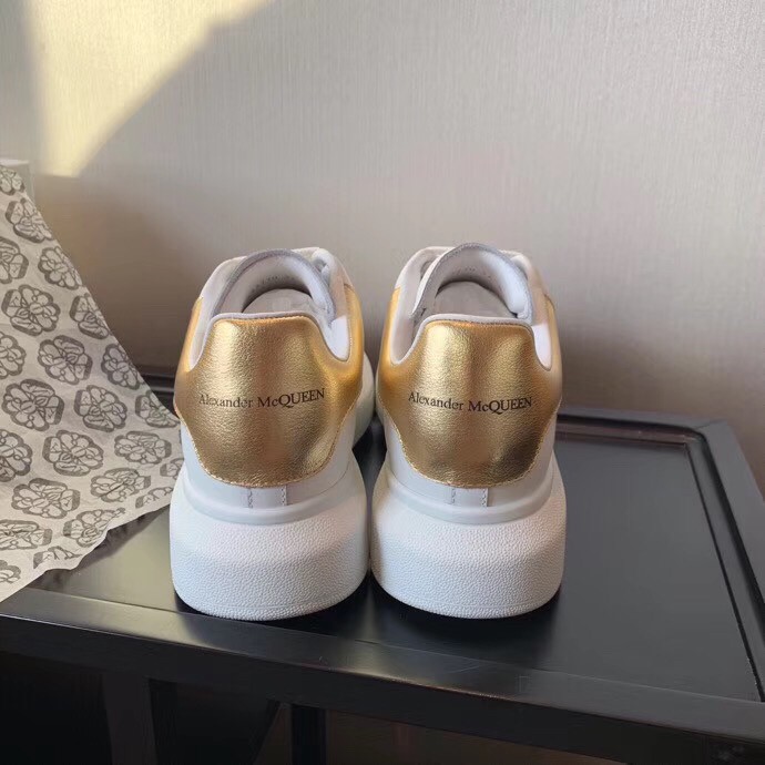 Replica Alexander McQueen Women’s Oversized Sneakers With Gold Heel 109